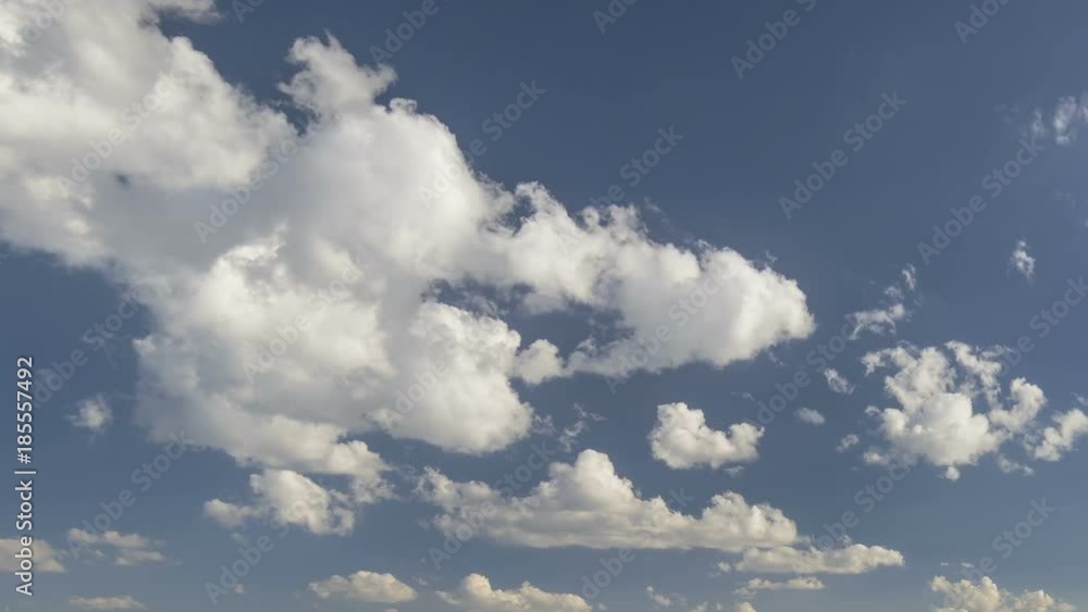 Russia, time lapse. Formation and rapid movement of white clouds of different shapes in the blue sky in late spring at sunset. Russia, time lapse. Formation and rapid movement of white clouds of different shapes in the blue sky in late spring at sunset.