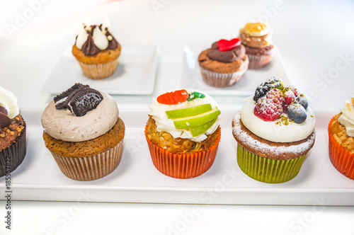 Tasty and creative cupcakes isolated with a white background