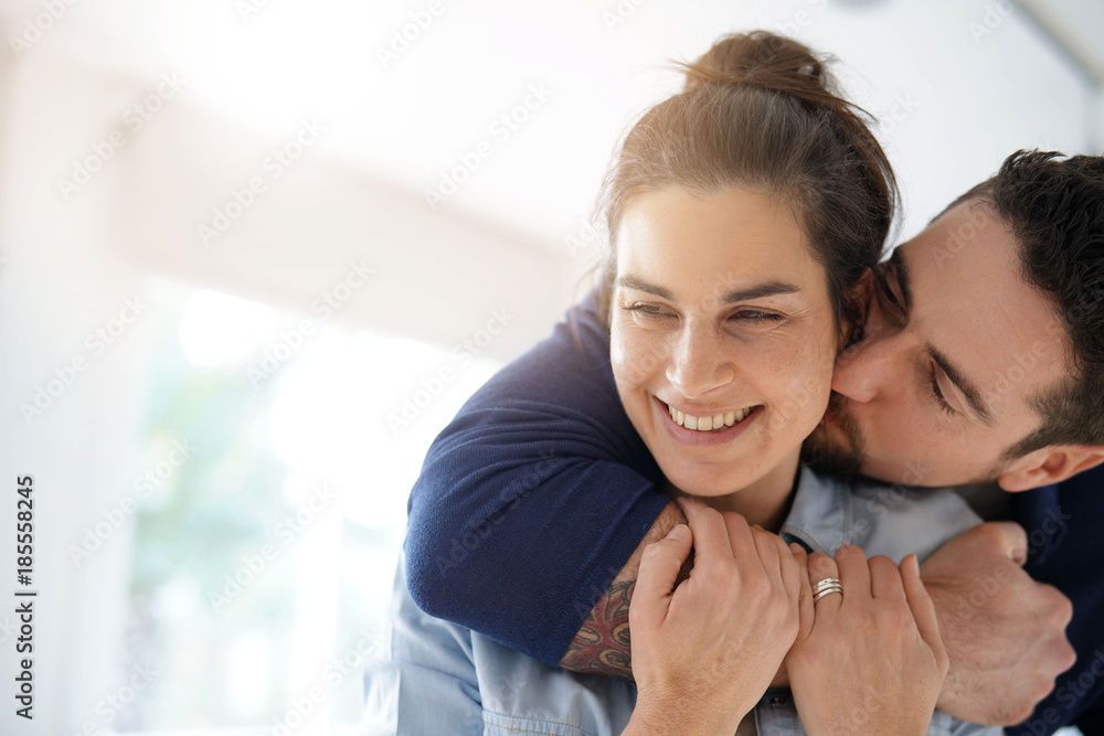Cheerful romantic couple of lovers cuddling Cheerful romantic couple of lovers cuddling