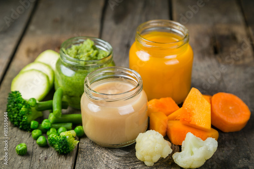 Colorful baby food purees in glass jars