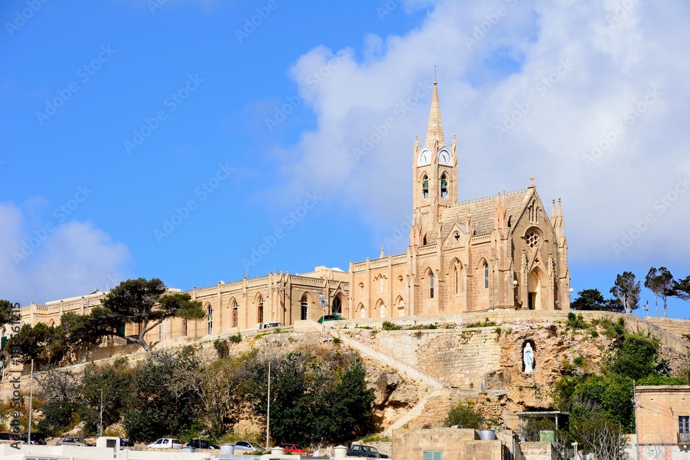 View of Our Lady of Lourdes church on the hillside, Mgarr, Gozo, Malta. View of Our Lady of Lourdes church on the hillside, Mgarr, Gozo, Malta.