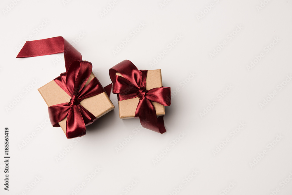 top view of gift boxes with red ribbons isolated o white