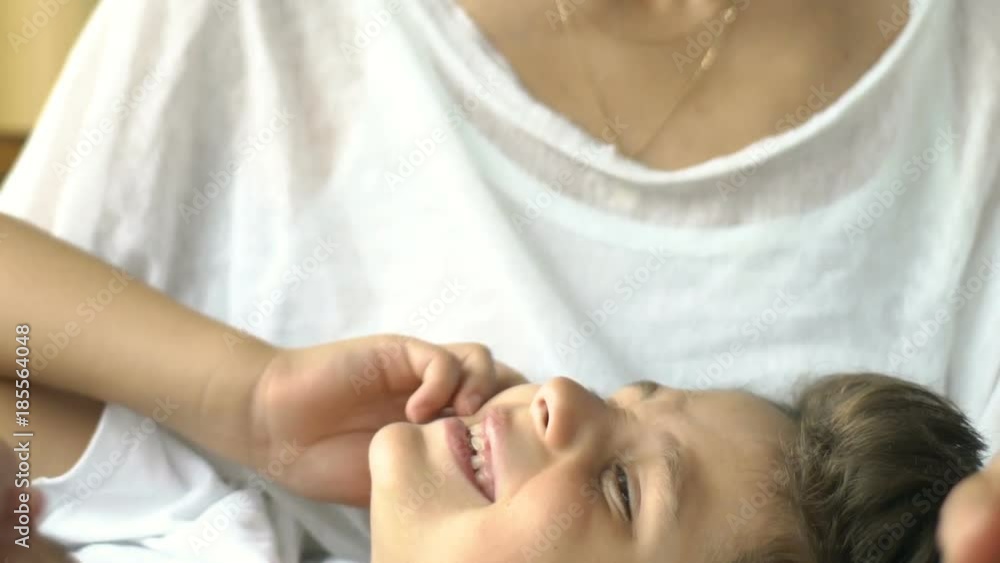 Son lying on his mother and chatting with her, steadycam shot
Son lying on his mother and chatting with her, steadycam shot