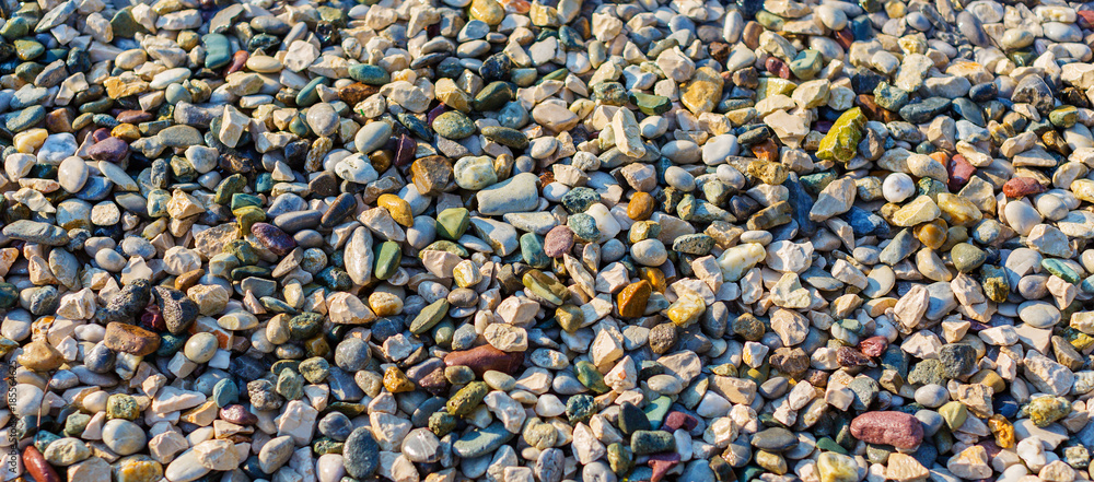 Colorful wet pebble beach background Colorful wet pebble beach background