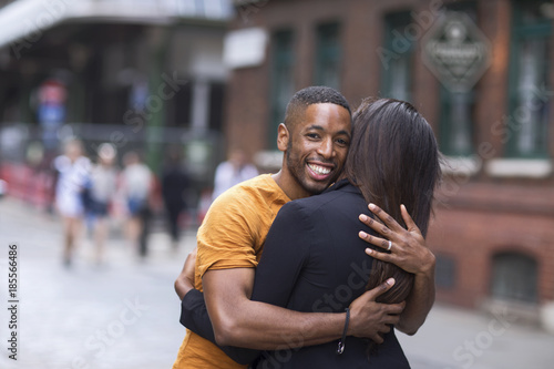 couple hugging in the street