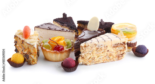 Variety of tasty sweets on white background