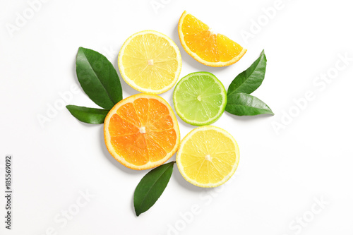 Composition with ripe lemon, orange and lime on white background
