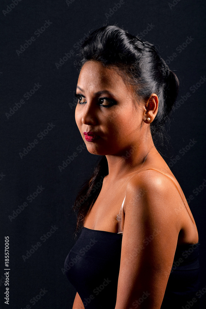 Model wearing black trendy clothes side view close up. Indoor Shoot. Black Background, Pune, Maharashtra. Model wearing black trendy clothes side view close up. Indoor Shoot. Black Background, Pune, Maharashtra.