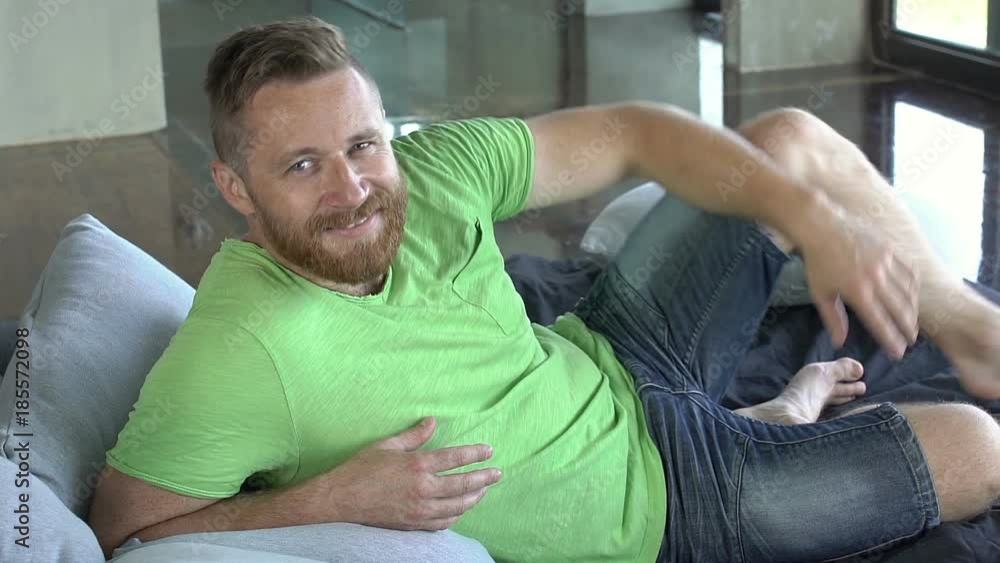 Handsome man lying on the bed and smiling to the camera, close up, steadycam shot
Handsome man lying on the bed and smiling to the camera, close up, steadycam shot