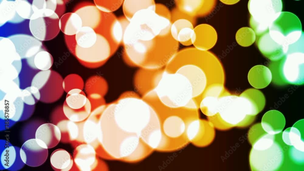 Blurred glowing colorful bokeh lights seamless loop background