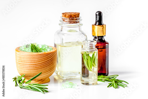 organic cosmetics with extracts of herbs rosemary on white backg