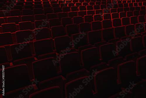 Velvet red empty seats in a theater.