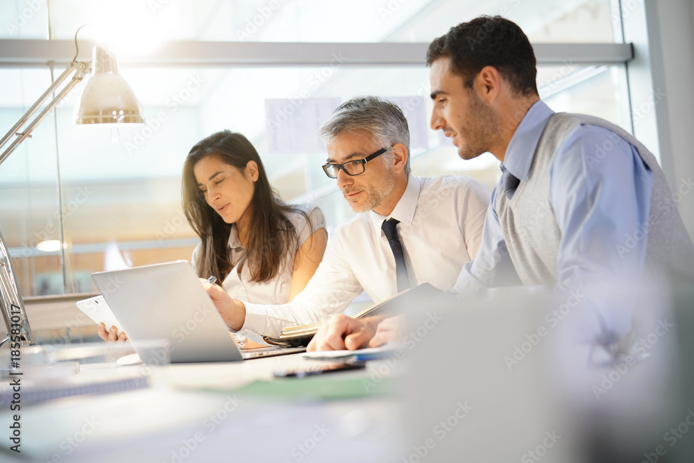 Business team working together on financial project Business team working together on financial project