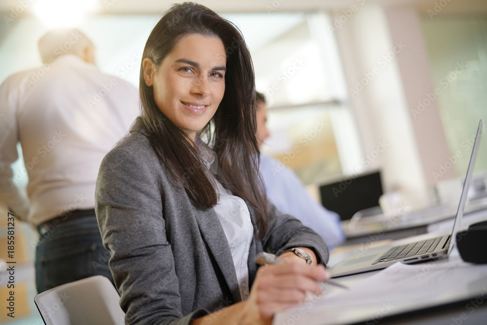 Businesswoman working in office on laptop computer Businesswoman working in office on laptop computer