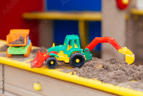 children's toys in the sandbox close-up