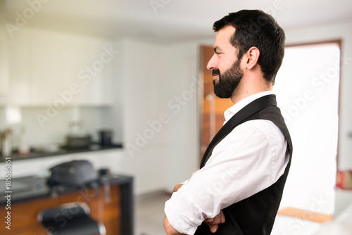 Cool man looking lateral inside house