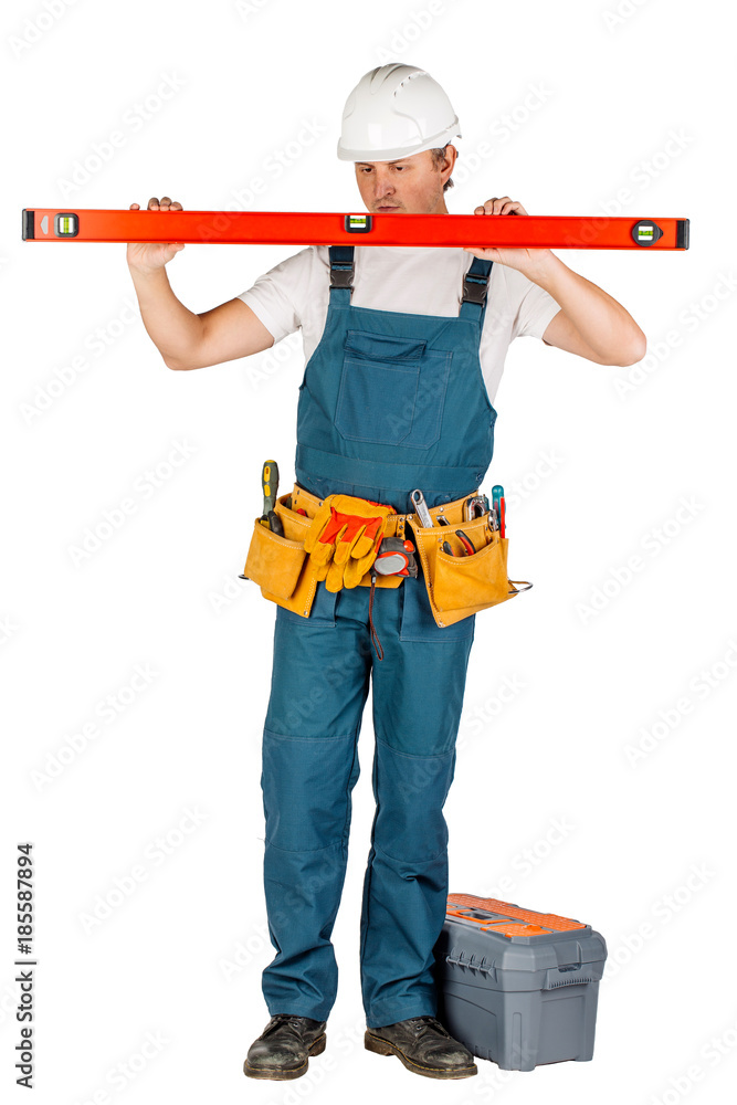 Full length portrait of a male builder in with helmet  over white wall background. repair, construction, building, people and maintenance concept.