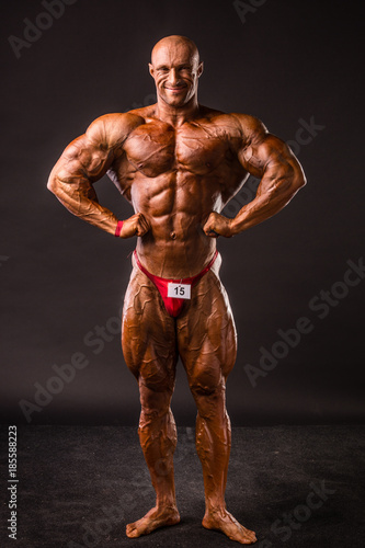 bodybuilder posing in studio