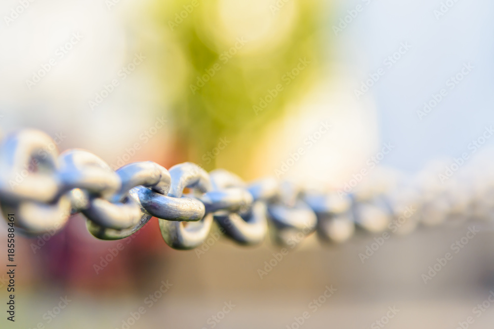 metal chain closeup stretched in the street metal chain closeup stretched in the street