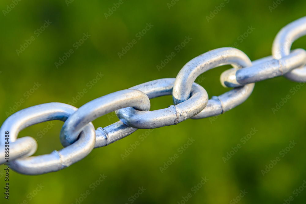 metal chain closeup stretched in the street metal chain closeup stretched in the street