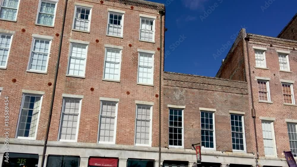 NEW ORLEANS - FEBRUARY 2016: City buildings on a sunny day. New Orleans attracts 15 million people every year NEW ORLEANS - FEBRUARY 2016: City buildings on a sunny day. New Orleans attracts 15 million people every year