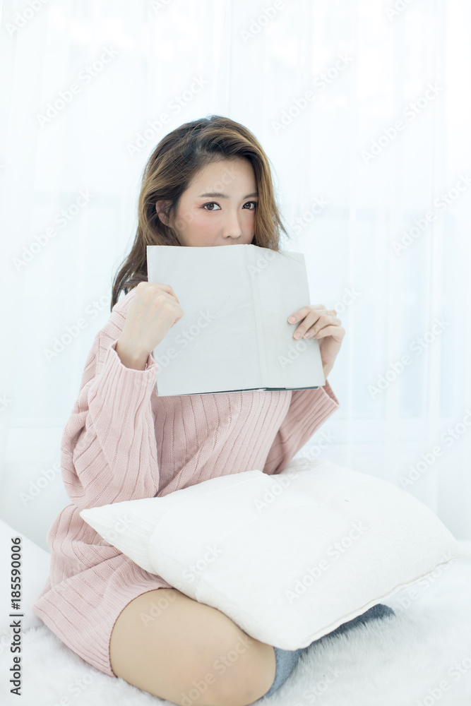 Attractive Asian Woman Holding book with happy emotion, People lifestyle concept. Attractive Asian Woman Holding book with happy emotion, People lifestyle concept.