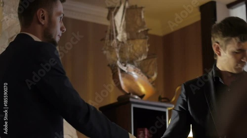 Formally dressed men handshake on the business meeting