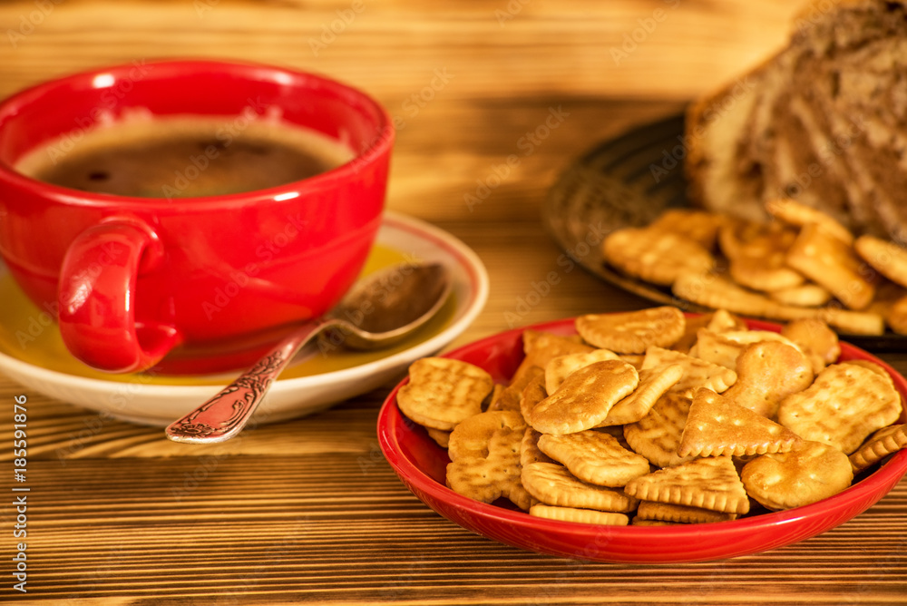 delicious cracker and fresh coffee on a wooden background delicious cracker and fresh coffee on a wooden background