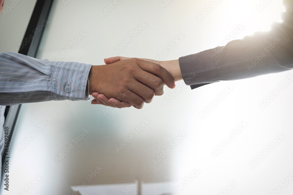 Meeting and greeting concept, Two confident Business handshake and business people after discussing good deal of Trading contract and new projects for both companies, success, partnership, co worker Meeting and greeting concept, Two confident Business handshake and business people after discussing good deal of Trading contract and new projects for both companies, success, partnership, co worker
