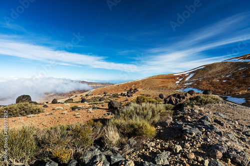 Teide National Park, Tenerife, Canary Islands - colourful soil of the Montana Blanca volcanic ascent trail. This scenic hiking path leads up to the 3718 m Teide Peak, the highest peak in Spain