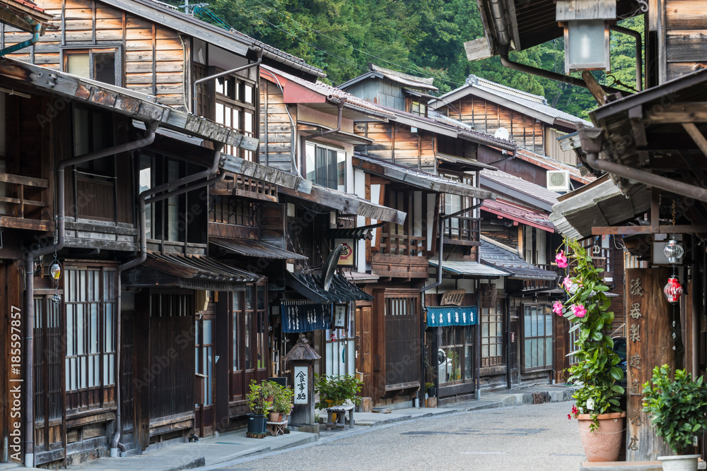 Narai-juku, Japan - September 4, 2017: Picturesque view of old Japanese town with traditional wooden architecture. Narai-juku post town in Kiso Valley, Japan