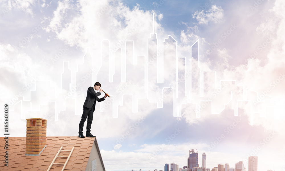 Engineer man standing on roof and looking in spyglass. Mixed media Engineer man standing on roof and looking in spyglass. Mixed media
