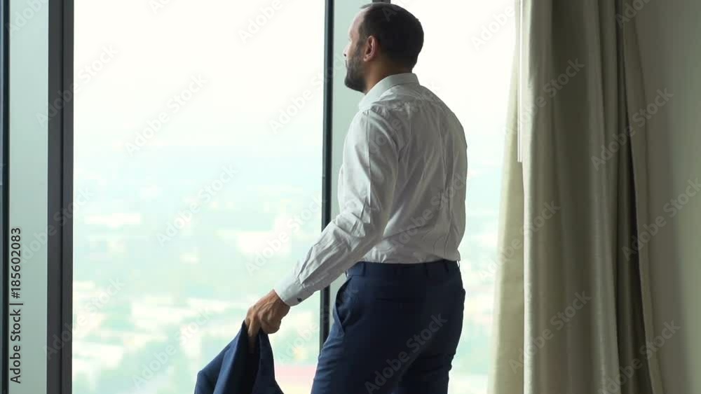 Young businessman admire view standing by window in office, super slow motion 240fps
Young businessman admire view standing by window in office, super slow motion 240fps