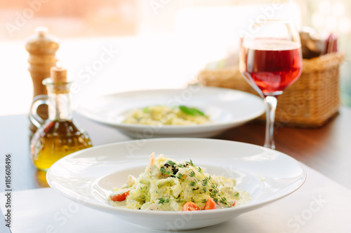 Italian food - fettuccine pasta with pesto sauce.