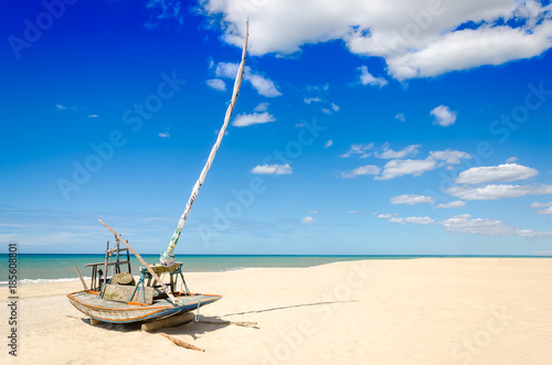 Parked jangada boat over a paradise beach