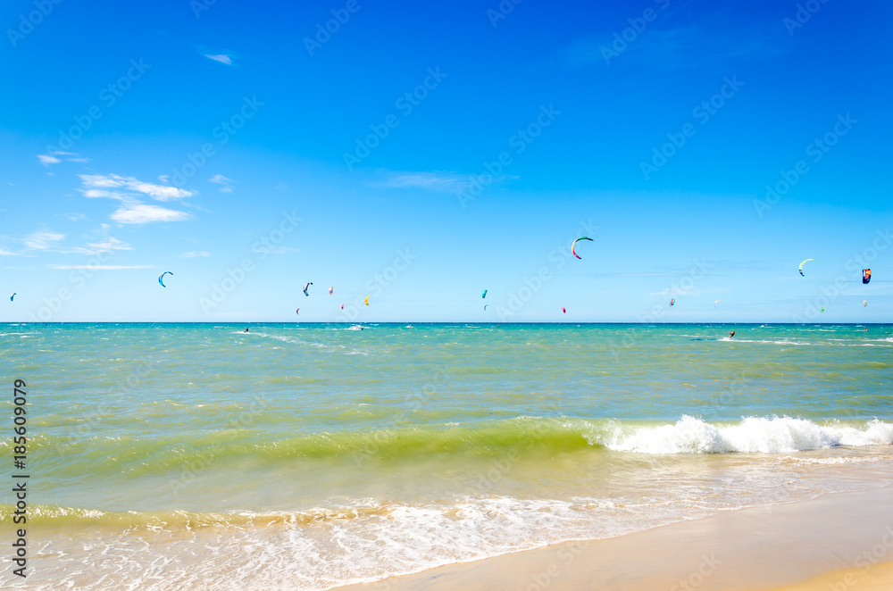 Many kite surfers enjoy their loved sport Many kite surfers enjoy their loved sport