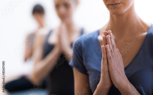 Women practicing yoga and meditation