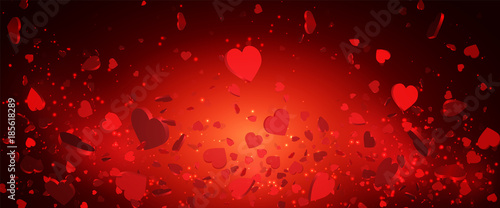 Heart confetti of Valentines petals falling on red background. Flower petal in shape of heart confetti for Women's Day