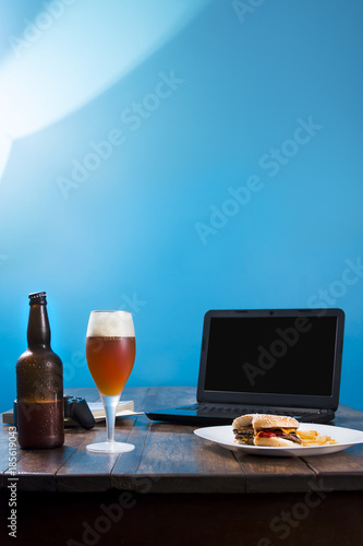 wooden table with beer and food