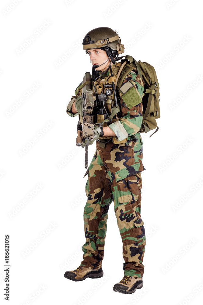 Portrait soldier or private military contractor holding sniper rifle. Portrait soldier or private military contractor holding sniper rifle.