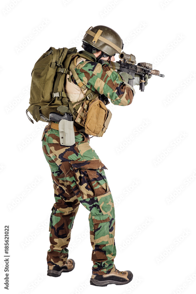 Portrait soldier or private military contractor holding sniper rifle. Portrait soldier or private military contractor holding sniper rifle.
