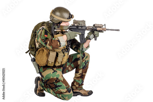 Soldier with rifle isolated on a white background. war, army, weapon and people concept.
