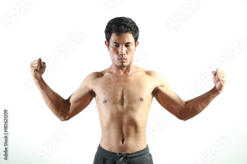 Young man fitness torso muscle strength on white 