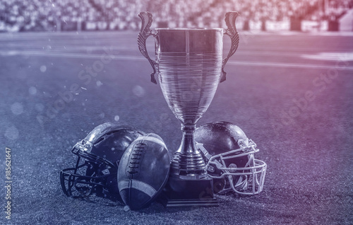 closeup of american football,helmets and trophy photo