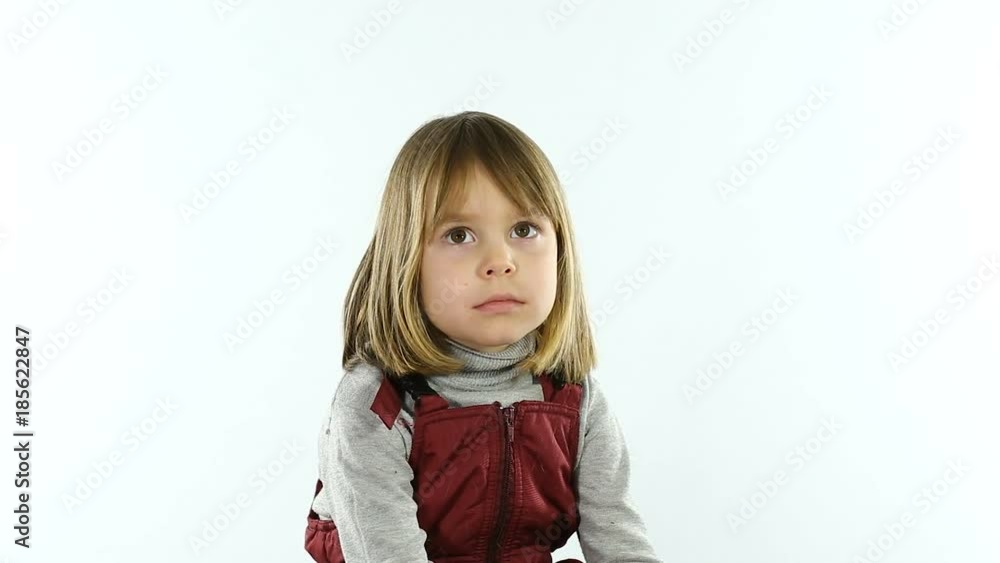 A little girl 4 - 5 years old, with blond hair, is photographed for obtaining a visa in the passport. A child of European appearance is going on a trip with his parents. The flash is working. Studio. A little girl 4 - 5 years old, with blond hair, is photographed for obtaining a visa in the passport. A child of European appearance is going on a trip with his parents. The flash is working. Studio.