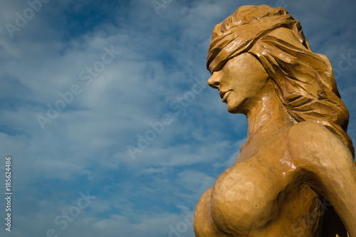 Tableau sur toile Wooden statue of the idol.