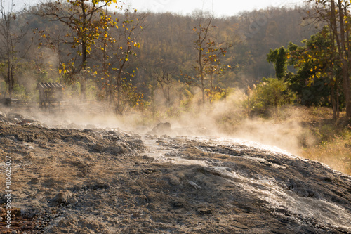 hot spring in Pai/hot spring in Mae Hong Son province in Northern Thailand/ Muang Paeng Hot Spring in Pai district /hot spring with the smell of hydrogen sulfide, mountain landscape on background