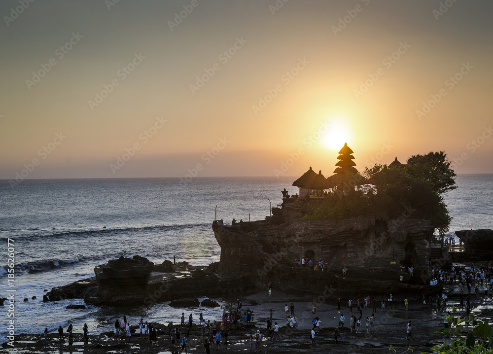 pura Goa Lawah hindu temple sunset silhouette in bali indonesia