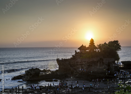 pura Goa Lawah hindu temple sunset silhouette in bali indonesia