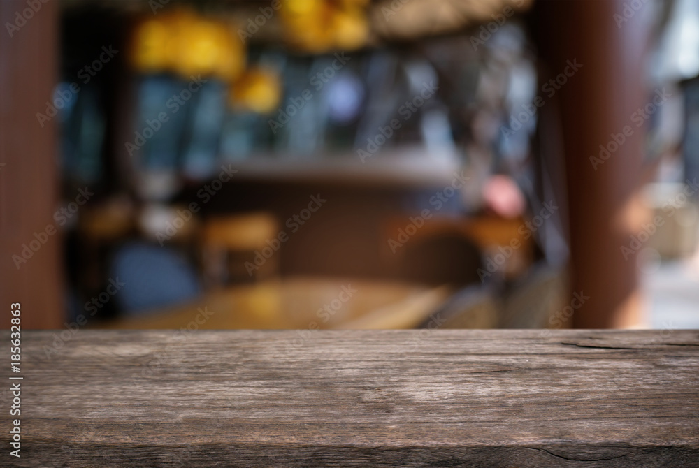 Empty wood table top and blur of night market background/selective focus .For montage product display. Empty wood table top and blur of night market background/selective focus .For montage product display.